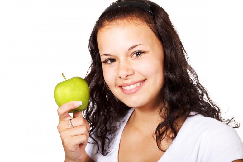 Free stock image of Girl with Apple created by Pixabay