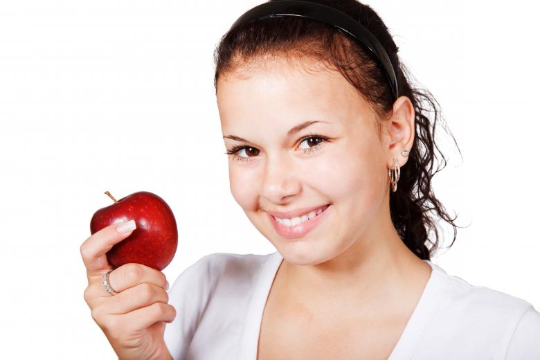 Free stock image of Girl with an Apple created by Pixabay
