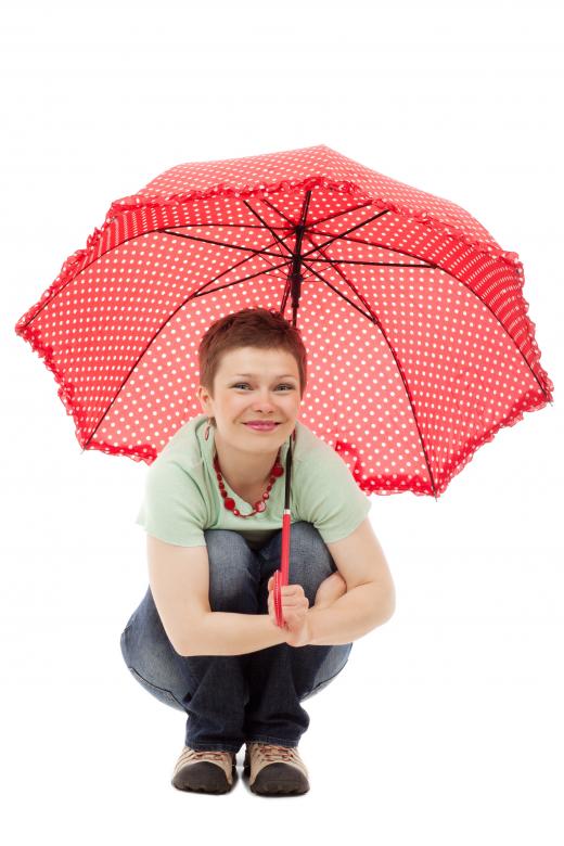 Free stock image of Girl Squatting with Umbrella created by Pixabay