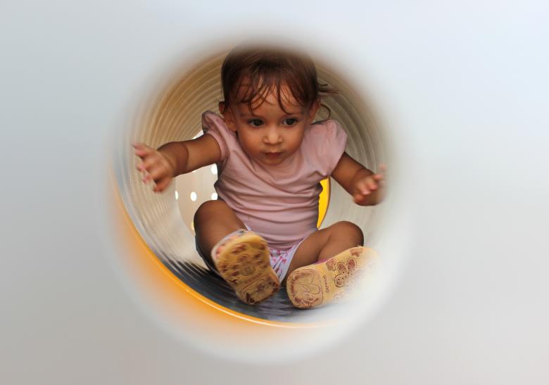 Free stock image of  Little Child Playing Inside Tube Playground created by Jack Moreh