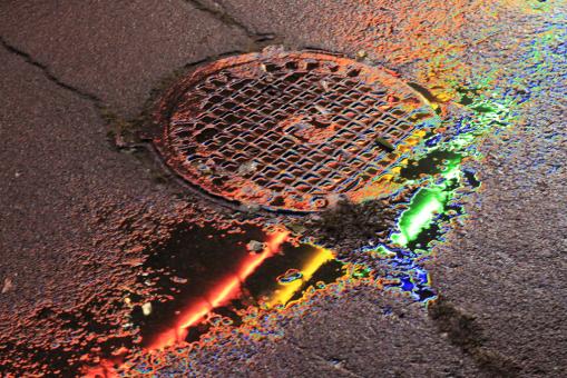 Rainbow Colors Reflected in Puddle - Free Stock Photo