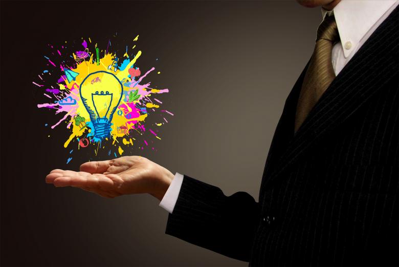 Free stock image of Ideas at Hand - Businessman and Painted Lightbulb created by Jack Moreh
