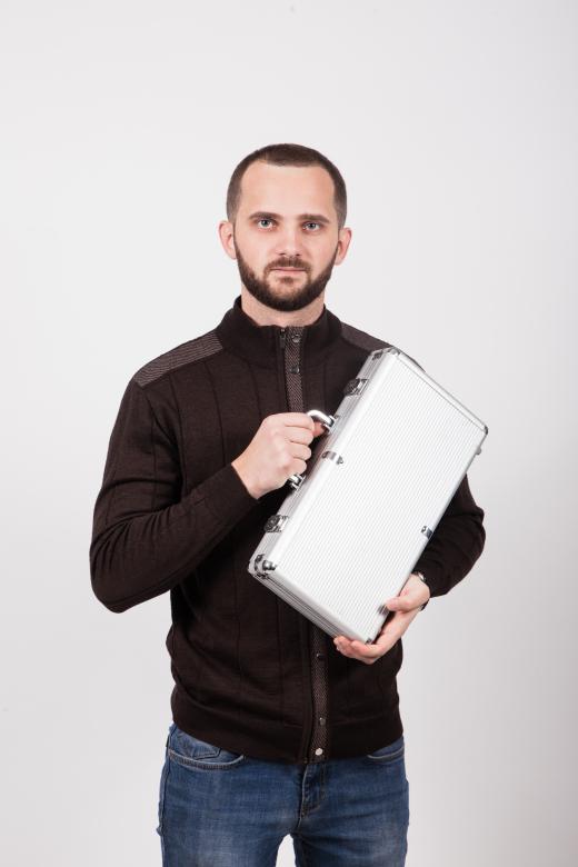 Free stock image of Man Holding a Case created by Ilona Hrechkina
