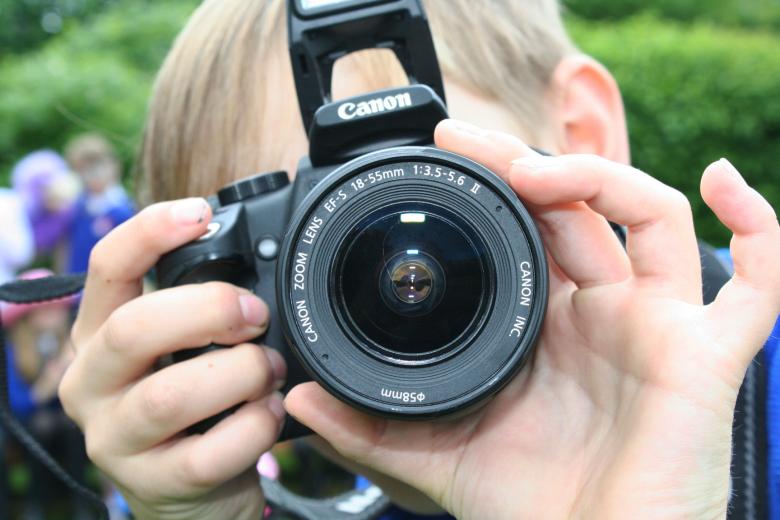 Free stock image of Young Boy Taking a Picture created by Christopher Terrance Owen