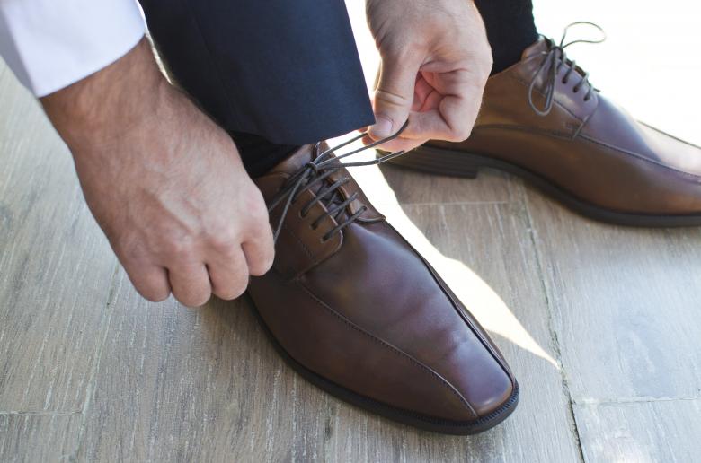 Free stock image of Gentleman Preparing his Shoes created by Lukas