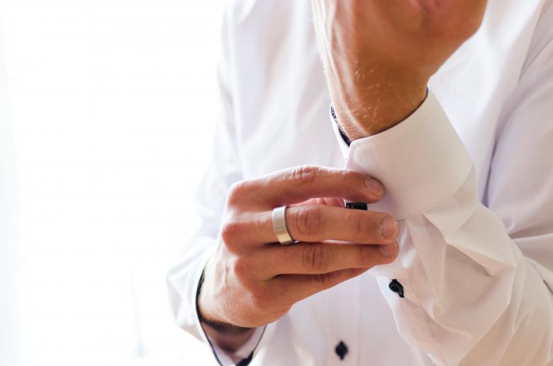 Free stock image of Man Buttoning His Shirt Sleeves created by Lukas