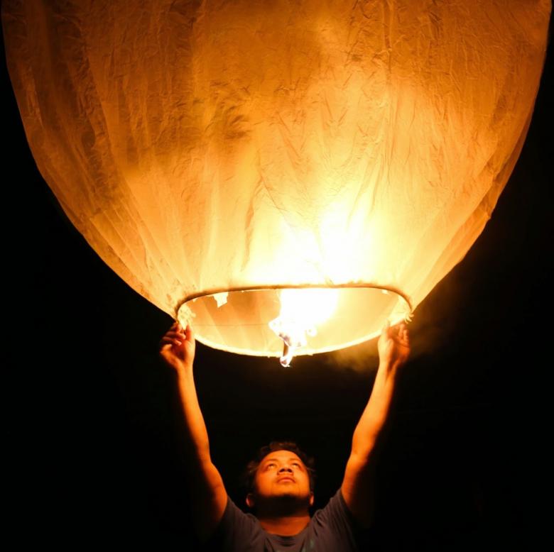 Free stock image of Man Holding a Big Wishing Light created by Md. Sharif Arefin Badhan