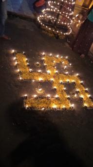 Swasthik symbol with decoration of lamps