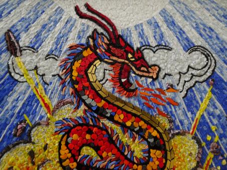Free Stock Photo of Puff the mosaic dragon, leaves by the sea