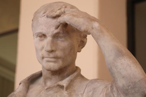 Stone sculpture of working man (detail) - Free Stock Photo