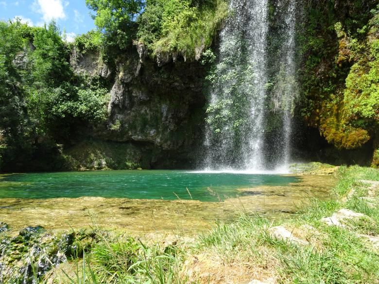 Free stock image of Waterfall above a green pond created by GAIMARD Jacques
