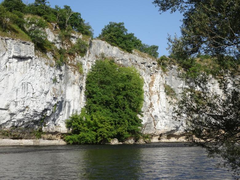 Free stock image of White limestone cliff dug by a river created by GAIMARD Jacques