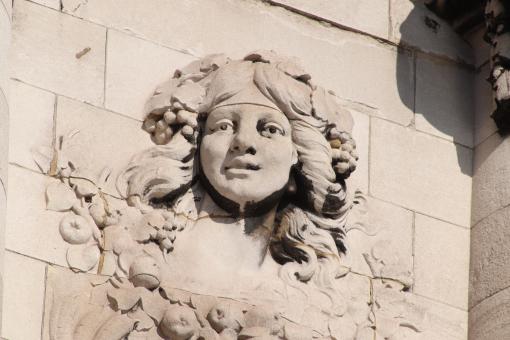 Stone sculpture of face on a wall - Free Stock Photo