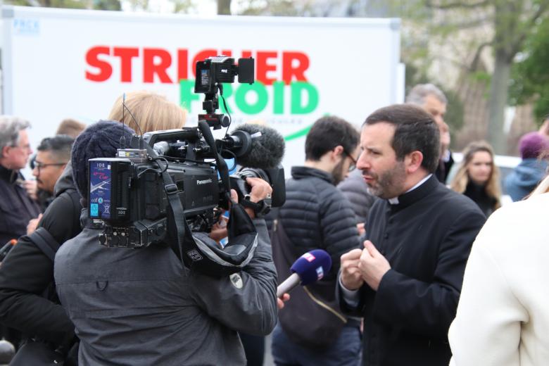 Free stock image of A priest from the cathedral being interviewed created by GAIMARD Jacques