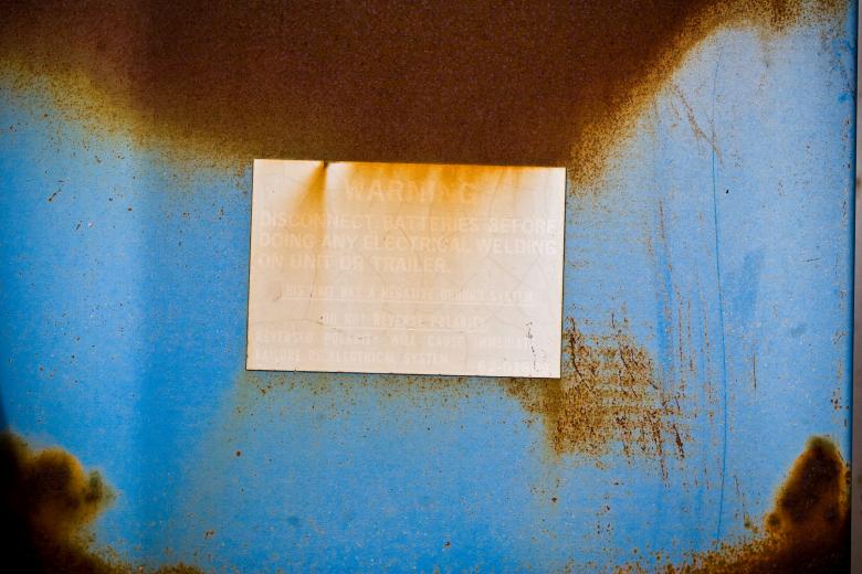 Free stock image of Aged Warning Sign on Rusted Blue Metal created by Bjorgvin