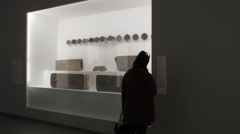 Free stock image of Museum visitor viewing decorative stone display created by Michiru Maeda