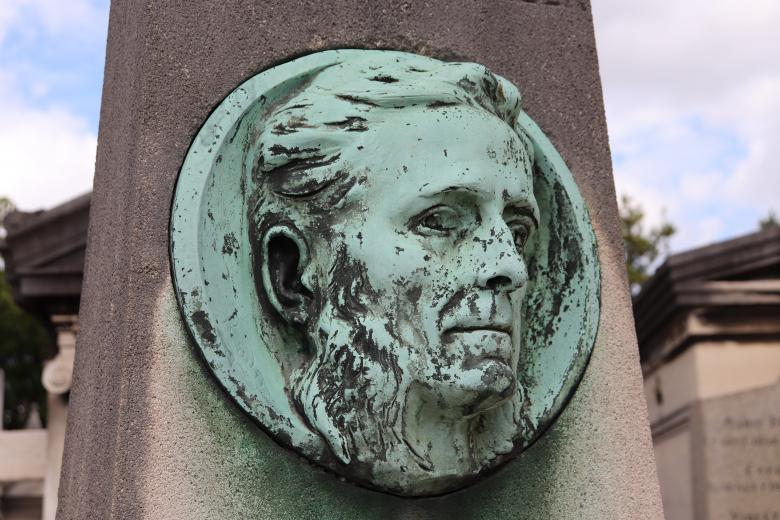 Free stock image of Small bronze rounded sculpture on a grave created by GAIMARD Jacques