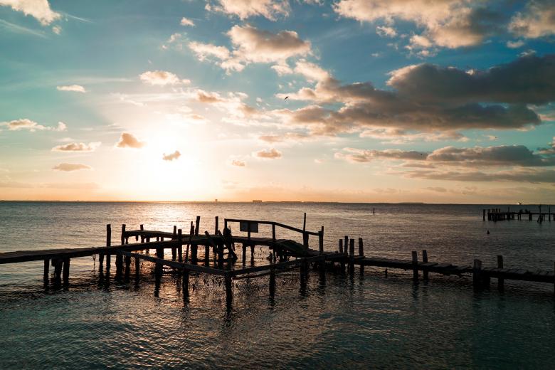 Free stock image of Sunset over the ocean - Pier Structure created by Aljoscha Laschgari