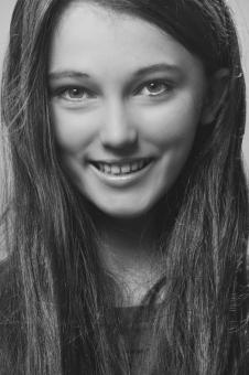 Free Stock Photo of Smiling Young Girl - Monochrome