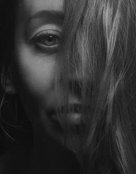Free Stock Photo of Girl with Hair Covered Face - Black and White Portrait