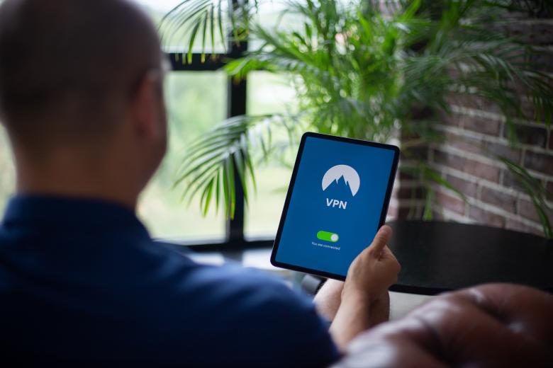 Free stock image of A man is trying to encrypt his internet traffic with a VPN application created by Morthy