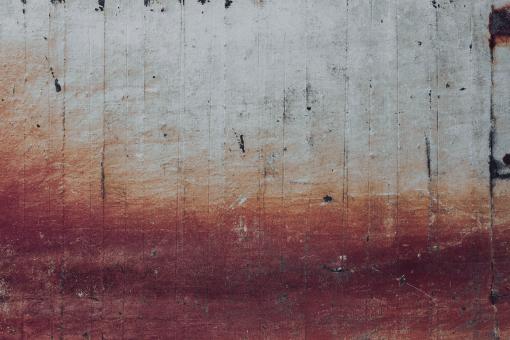 Gradient Red Rust on Concrete Wall