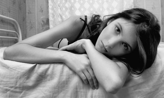 Free Stock Photo of Girl in Bed - Black and White Portrait