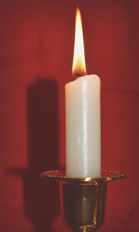 Free stock image of Candle on a red background created by NomeVizualizzato