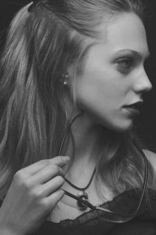 Free Stock Photo of Girl Holding Glasses - Monochrome Profile