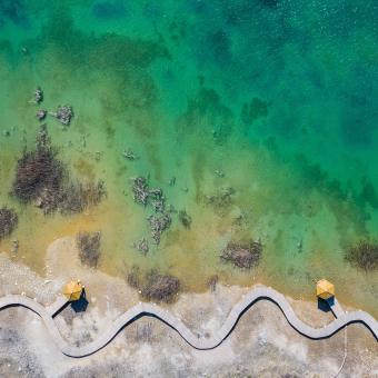 Aerial view of wooden path over turquoise lake colour - Free Stock Photo