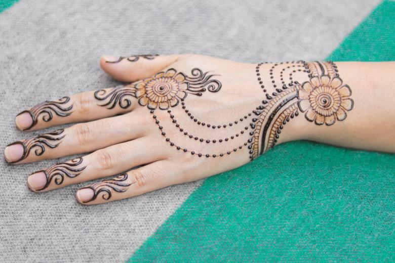 Free stock image of Hand with brown mehndi tattoo created by Mehndi Training Center