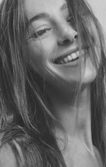 Free Stock Photo of Beautiful Girl Smiling - Black and White Portrait