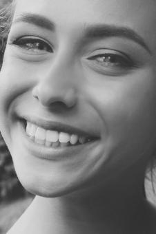 Free Stock Photo of Smiling Girl - Monochrome Portrait