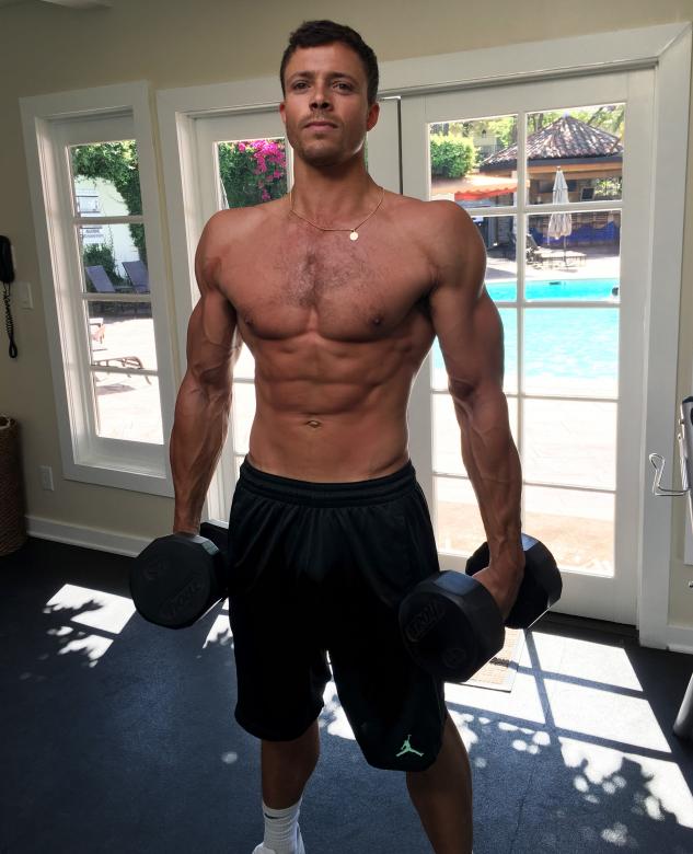 Free stock image of Man holding dumbbells created by Isaac Robertson