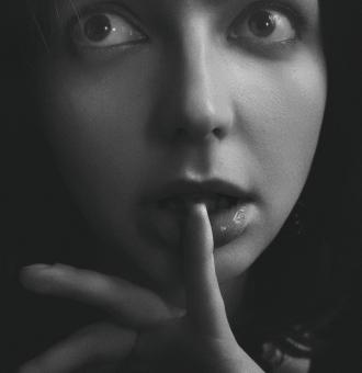 Free Stock Photo of Beautiful Girl - Finger on Lips - Monochrome