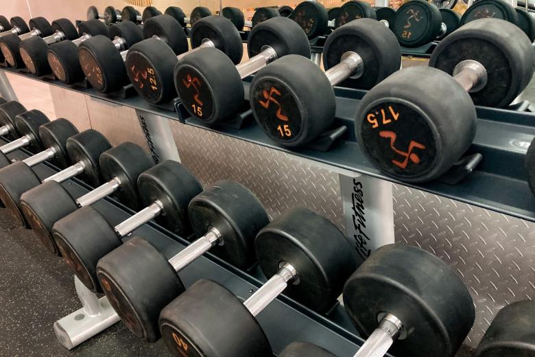 Free stock image of Dumbbells in a rack created by Isaac Robertson