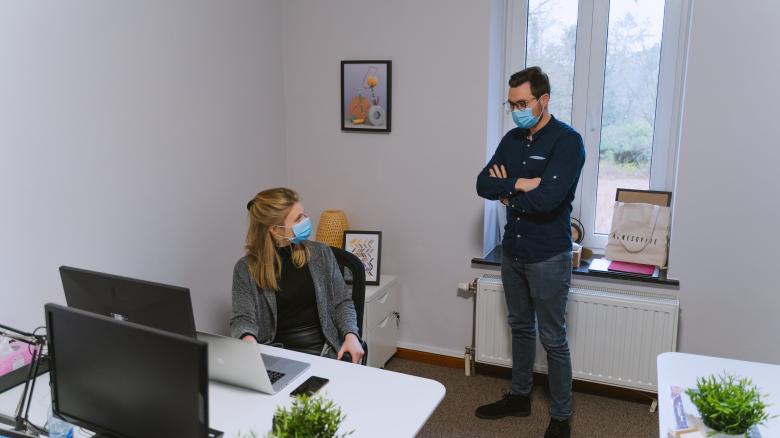 Free stock image of Coworkers Talking with Masks created by Maxime
