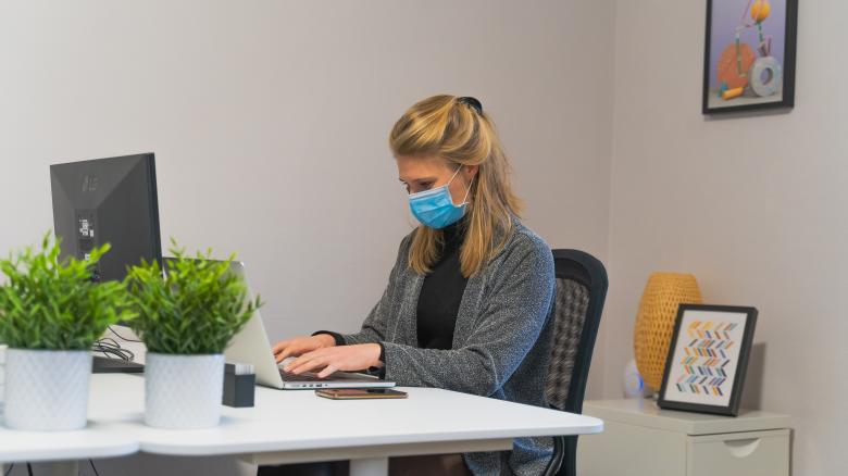 Free stock image of Woman Working in Office with Face Mask created by Maxime