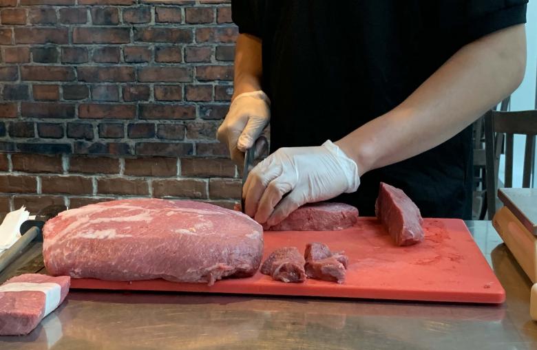 Free stock image of Butcher cutting meat created by TImothy Woods