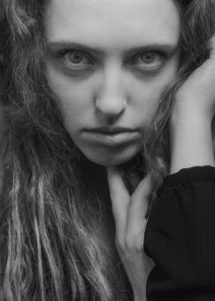 Free Stock Photo of Serious Woman with Long Hair - Monochrome Portrait