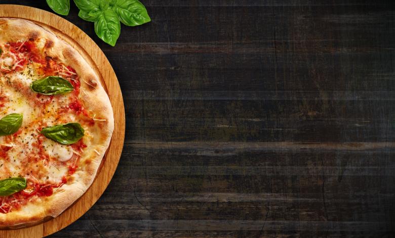 Free stock image of Pizza on Dark Wood Background - With Copyspace created by Jack Moreh