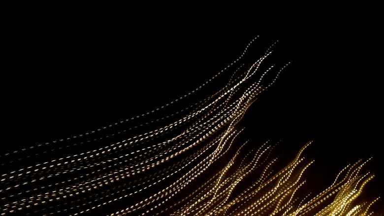 Free stock image of golden dashed lines of lights on black background created by Krzysztof Bubel