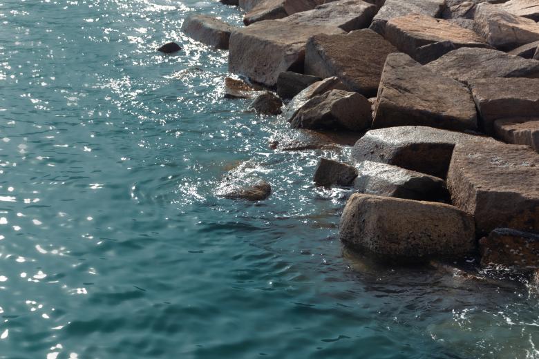 Free stock image of Small waves hitting rock on the beach created by Ben Wong