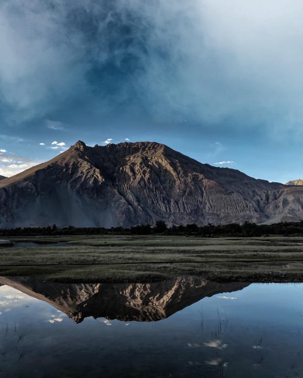 Free stock image of Reflection of mountain in water created by shubham sharma