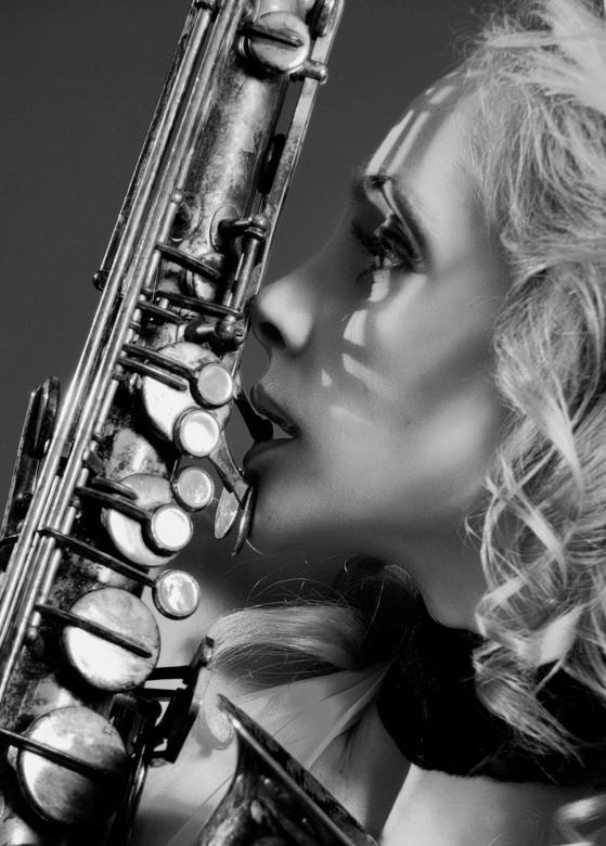 Free stock image of Saxophone musician created by Alexander Krivitskiy