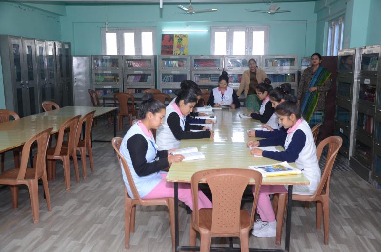 Free stock image of girls studying in library created by Kol Valley Institute of Nursing