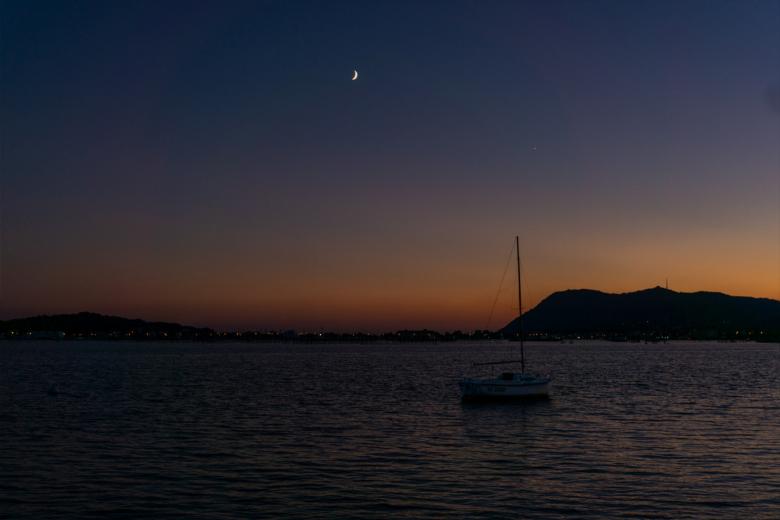 Free stock image of A boat on the sea at sunset created by Dreamlandscape