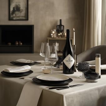 Vine botal and glass on table