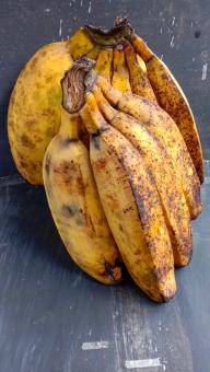 A banana with a close-up, against a black background, A banana f