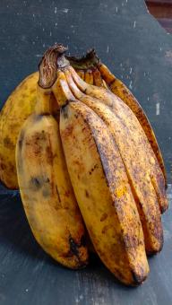 A banana with a close-up, against a black background, A banana f